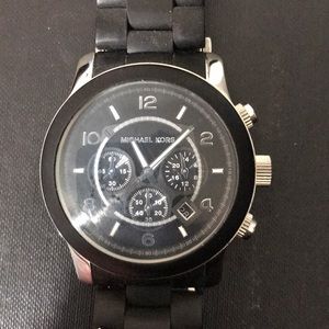 Authentic Michael Kors large faced black watch.